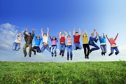 Big group of young jumping people.